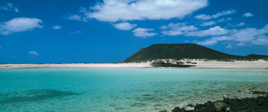 Lobos Island silhouette and clear turquoise waters